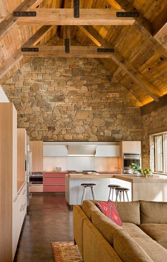 contemporary-island-in-white-and-cabinets-combined-with-a-captivating-rustic-backdrop-in-the-kitchen