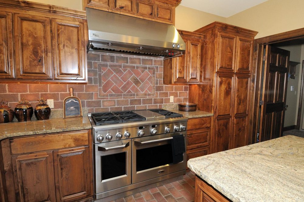 kitchen-rustic-kitchen-decoration-with-brown-wooden-kitchen-cabinet-and-island-designed-with-granite-top-combine-with-brown-brick-backsplash-tiles-and-floor-kitchen-with-brick-backsplash